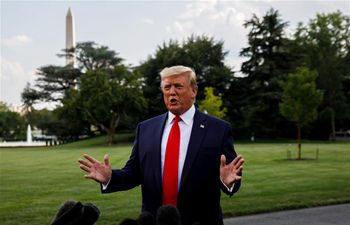 Donald Trump speaks to reporters before leaving White House