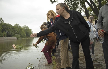 People commemorate victims of terrorist attack in Turku, Finland