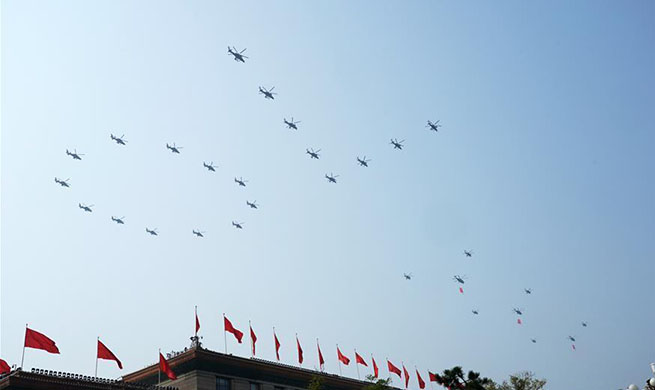 Military parade starts with flag-guarding echelon flying over Tian'anmen Square